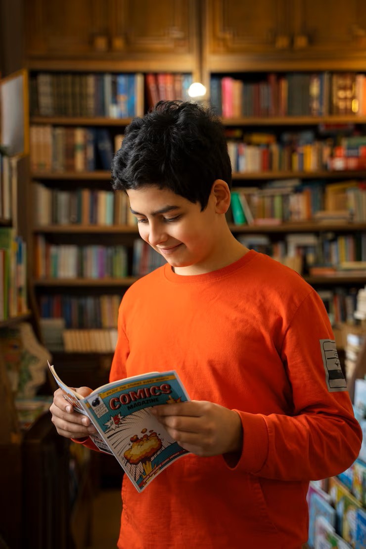 boy reading comics library